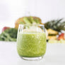 Image of Love Craft Smoothie, with fruit in the background, by Living Farmacy Inc., frozen smoothie subscription Canada.