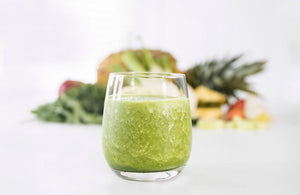 Image of Love Craft Smoothie, with fruit in the background, by Living Farmacy Inc., frozen smoothie subscription Canada.
