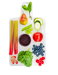 Top view image of rhubarb, blueberries and other vegetables on white background.